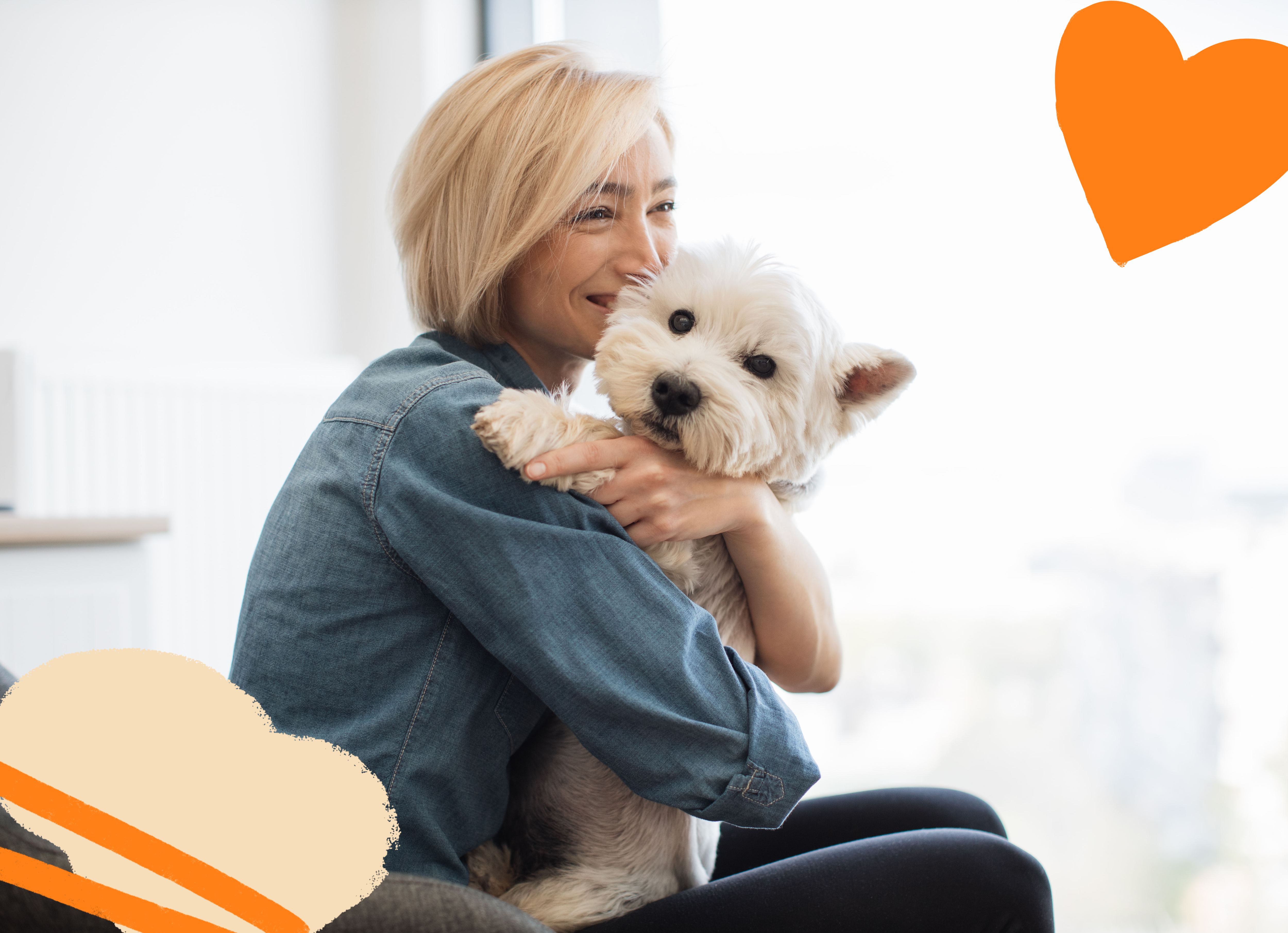 Woman with blond hair holding a white dog in her arms